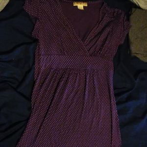 A purple shirt with white pokadots
